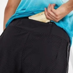 KIPRUN WOMEN'S 2-IN-1 RUNNING SHORTS WITH BUILT-IN TIGHT SHORTS -Running equipment k0b3f9ac3cb9e0db824fce4d6ccaa9a6e